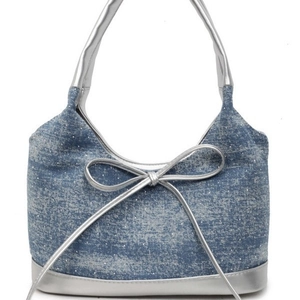 Spacious blue denim tote bag with silver bow detail and polka dot texture for women