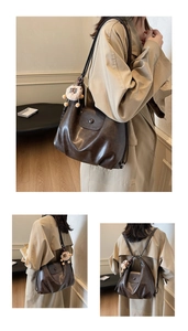 Detail view of dark coffee leather convertible tote with cute lamb pendant accessory