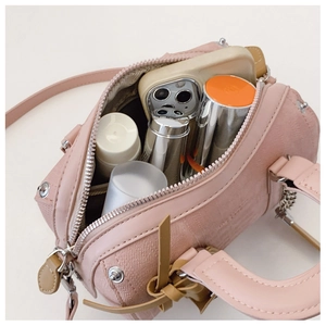 Pink Boston mini bag interior view showing storage space for phone and makeup