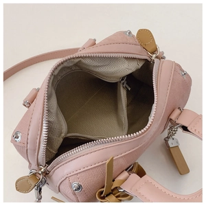 Detail of Boston bag interior with gray herringbone lining and zippered pocket