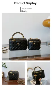Close-up of black quilted bucket bags with gold chain straps and metal handles