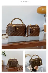 Detail view of coffee brown quilted bucket bags with metal flower and chain straps