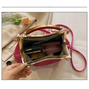 Internal capacity of pink woven bag showing lipstick and skincare products