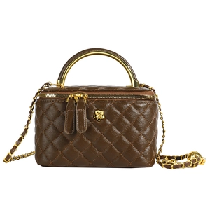 Quilted dark brown bucket bag with golden camellia logo and chain shoulder strap