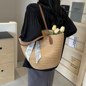Large straw tote bag with brown PU straps and decorative scarf for beach vacation
