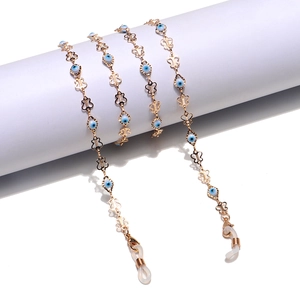 Golden handmade glasses chain with blue evil eye beads and decorative butterfly links
