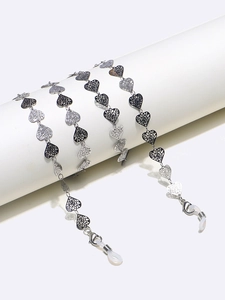 Detail of heart-shaped links on stainless steel eyewear chain with anti-slip silicone loops