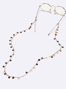 Chic gold metal eyewear chain featuring small square pendants and silicone loops
