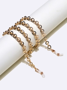 Detail of golden thick aluminum chain for glasses with lobster clasps and silicone loops