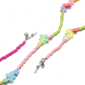 Colorful beaded eyewear chain with pastel flowers and nonslip silicone loops for glasses