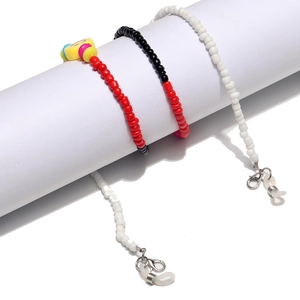 Close-up of colorful seed bead eyewear chains with smiley face charms and lobster clasps