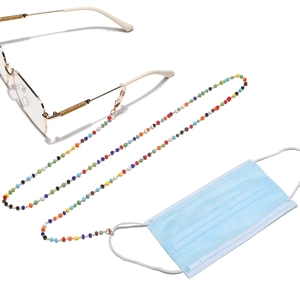Colorful beaded chain for glasses and masks with golden lobster clasps on white background