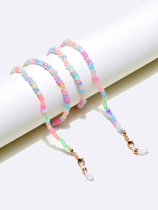Detailed macro view of colorful macaron beads on a flexible multi-purpose chain strap