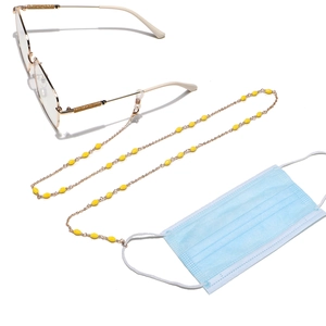 Handmade yellow crystal bead eyewear chain with gold lobster clasps on white background