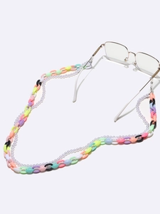 Close-up of double-layered acrylic chain and faux pearl eyewear strap with colorful links