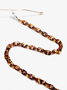 Close-up of leopard pattern acrylic eyewear chain with gold lobster clasps and silicone loops