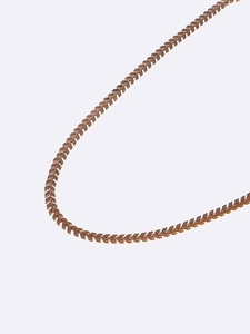 Close-up of rose gold copper chain featuring V-shaped arrowhead link design for eyewear