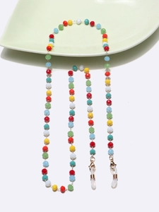 Detail of colorful faceted crystal beads and gold metal links on a non-slip eyewear chain