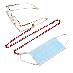 Detail of red beaded glasses chain with gold lobster clasps used for eyewear and masks