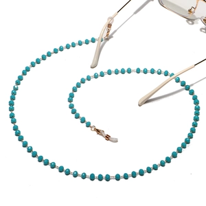 Detail of turquoise crystal beaded eyewear chain with non-slip rings and gold connectors
