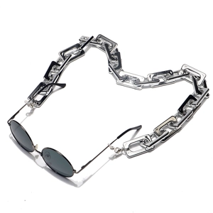 Retro round sunglasses with polished silver rectangle link metal chain on white background