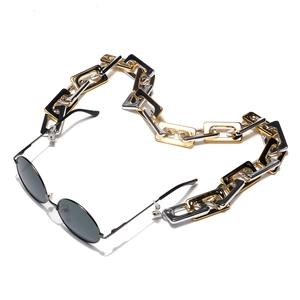 Rectangle link eyewear chain in gold and silver finish with black sunglasses