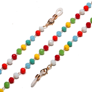 Detail of colorful faceted crystal beads and gold metal chain for eyewear holder straps
