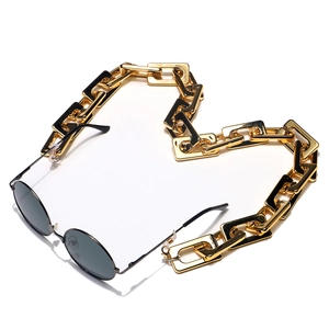 Retro black round sunglasses with bold gold rectangular chain link leash accessory