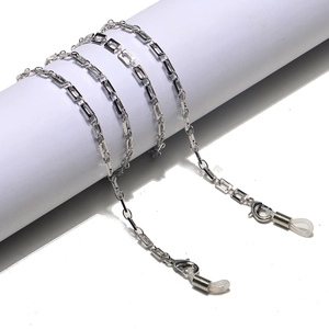 Detail of silver rectangle link eyewear chain with lobster clasps and silicone loops