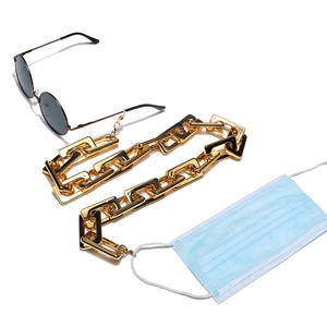 Polished gold rectangular link chain used as a stylish glasses and face mask lanyard