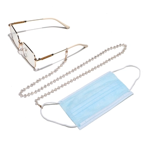 Close-up of crystal beaded chain with gold clasps on eyewear and blue mask