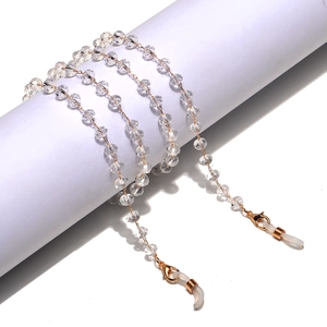 Detail of colorful crystal eyeglass chain with golden lobster clasps and non-slip loops