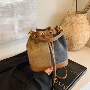 Retro color-block bucket bag in brown leather and denim with golden hardware