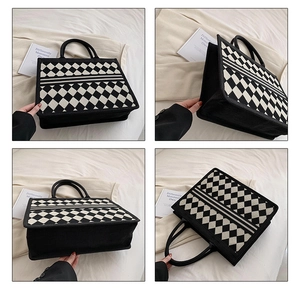 Multi-angle view of a large black and white checkerboard woven tote bag with top handles
