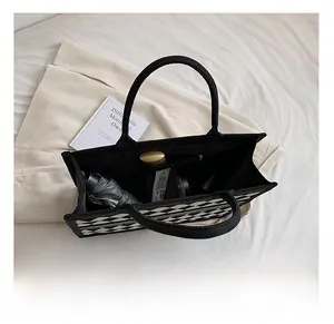 Top view of open tote bag interior showing large capacity for umbrella and daily items