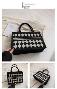 Detail of medium black tote bag with diamond pattern and large capacity for commuting