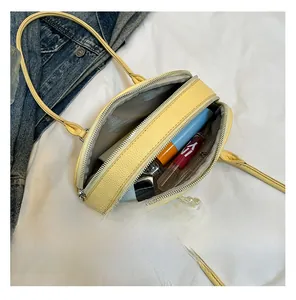 Internal view of a yellow half-round PU leather Boston bag with ample storage capacity