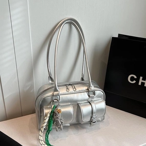 Metallic silver multi-pocket shoulder bag with bear charm and vintage Y2K aesthetic
