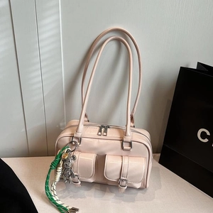 Pink patent leather shoulder bag with multiple pockets and cute bear charm pendant