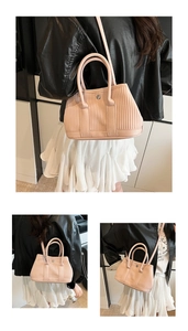Detail of pink tote bag with vertical striped embossing and versatile shoulder straps