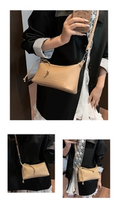 Close-up of vertical pleated texture and drawstring detail on beige crossbody bag