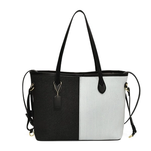Grand sac cabas en toile bicolore noir et blanc avec anses en cuir et rivets dorés
