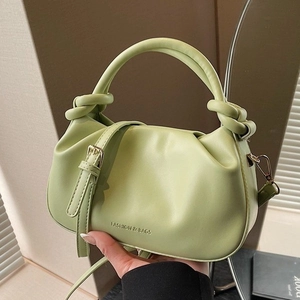 Avocado green pleated bucket bag with knotted handle and detachable shoulder strap