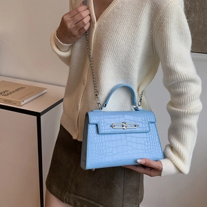 Light blue faux crocodile leather Kelly style handbag with silver chain strap and top handle