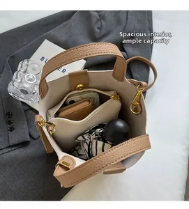 Top view of spacious bucket bag interior with storage compartments and daily items
