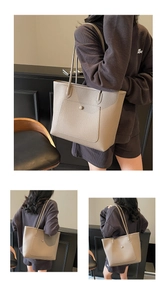 Detail view of large elephant grey tote bag with front pocket and metal stud closure