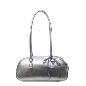 Silver metallic pleated handbag with a blue gingham bow detail and long shoulder straps
