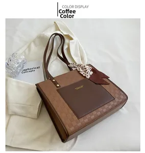 Detailed view of brown checkered tote bag featuring a decorative leopard print scarf