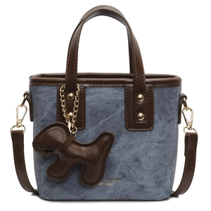Mini bucket bag in blue denim with brown leather trim and cute puppy charm