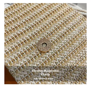 Close-up of the woven straw texture and the strong magnetic clasp on the small bag